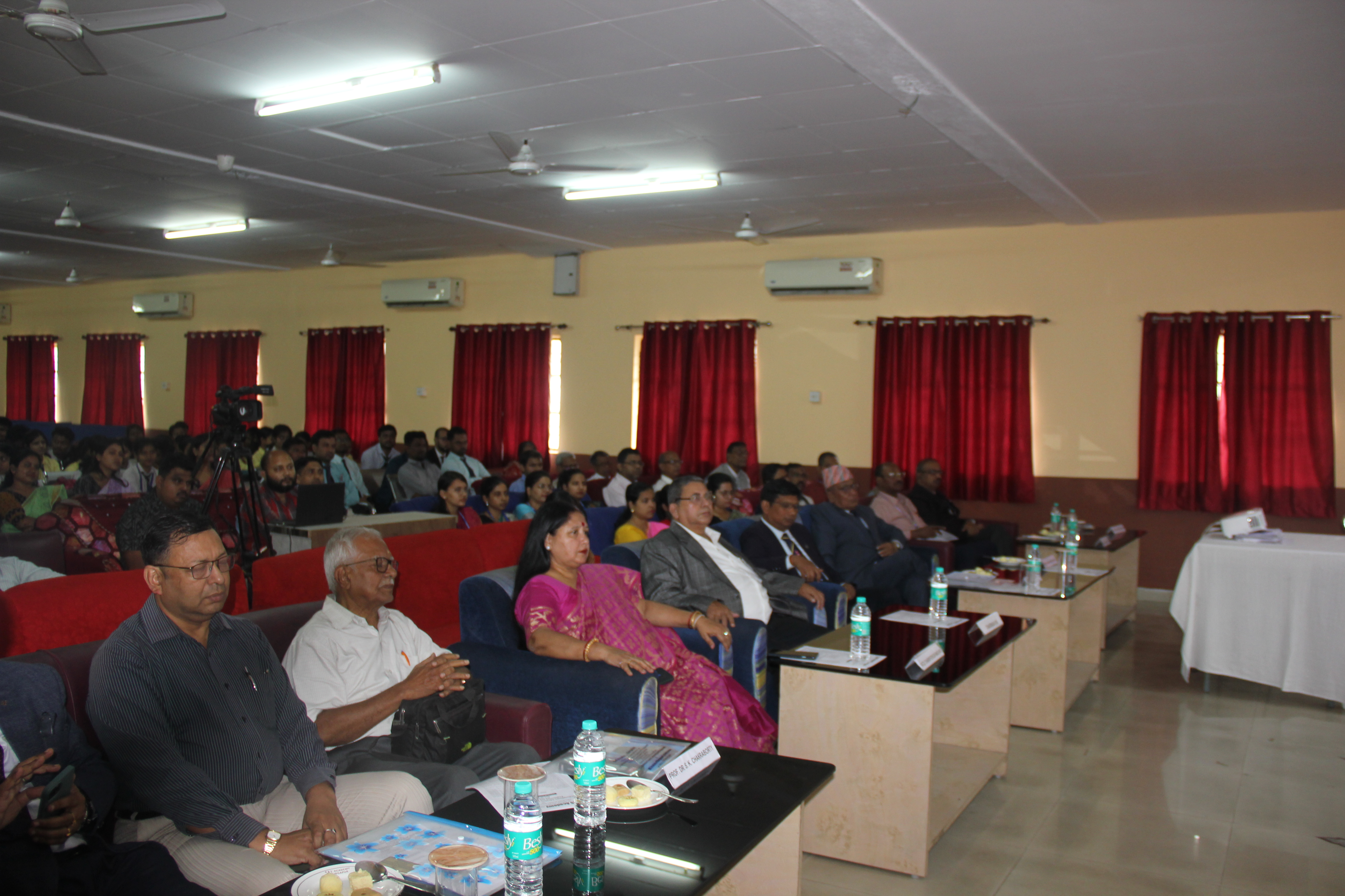 International Conference opening session speakers at podium